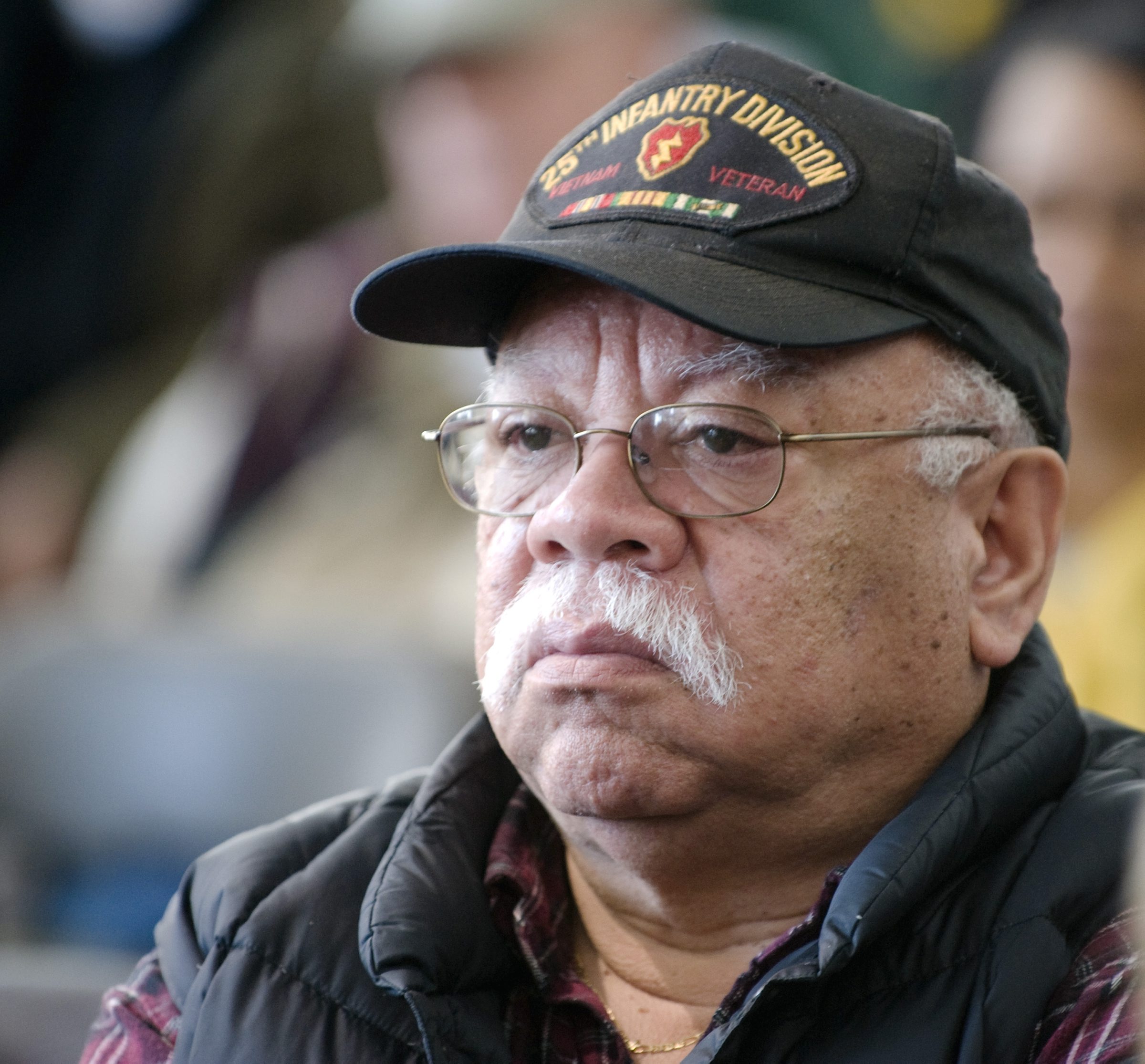 Hugh Reyes, of Uniondale, listened as names of NY Vietnam War dead were read aloud. (Newsday photo) - hugh_reyes
